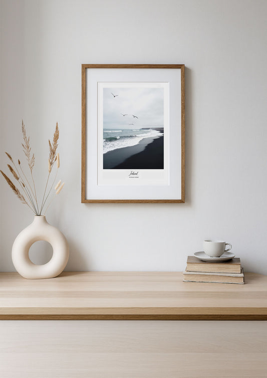 Framed artwork on a wooden shelf with decorative items