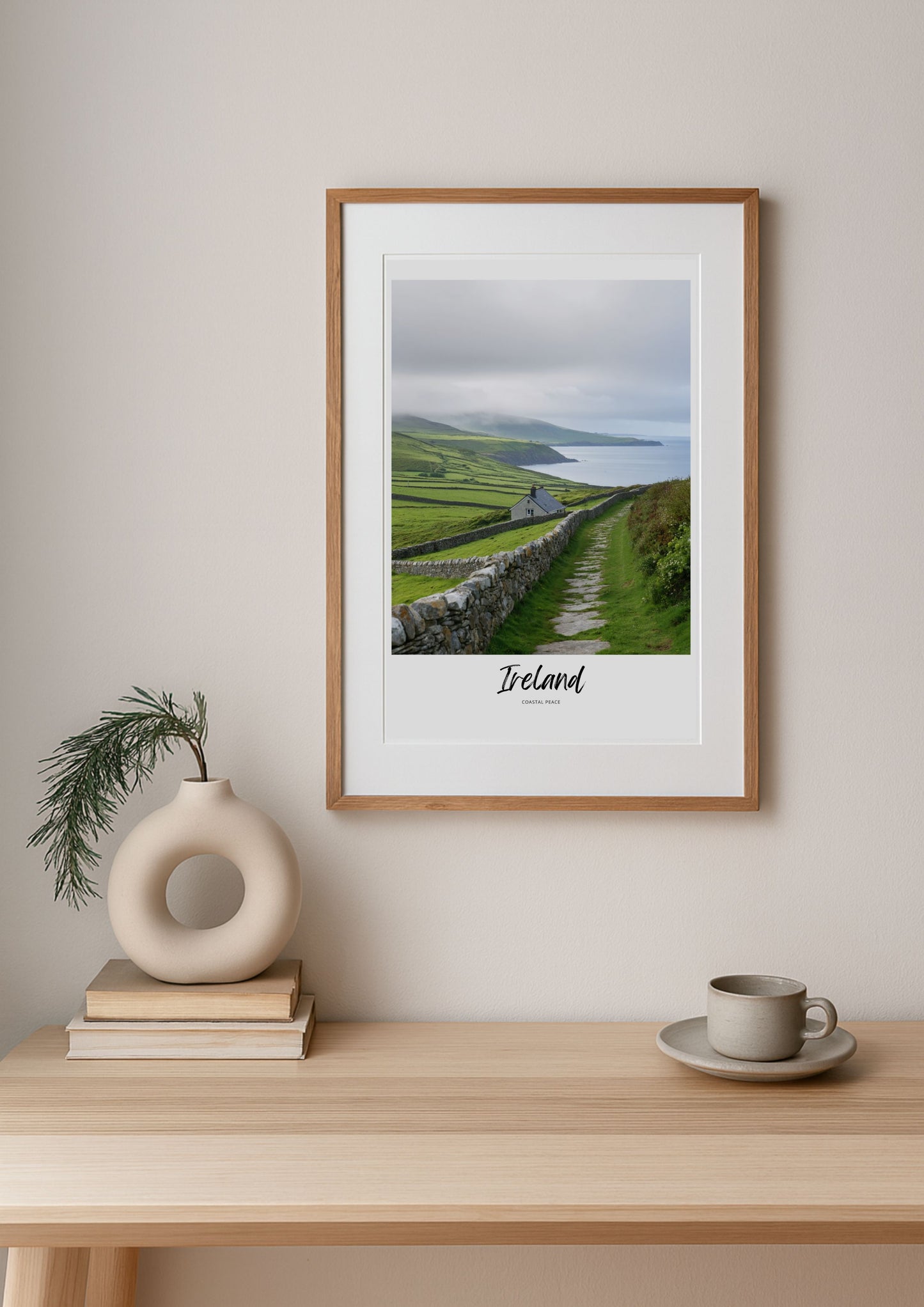 Framed print of Ireland on a wall above a wooden table with decor items.