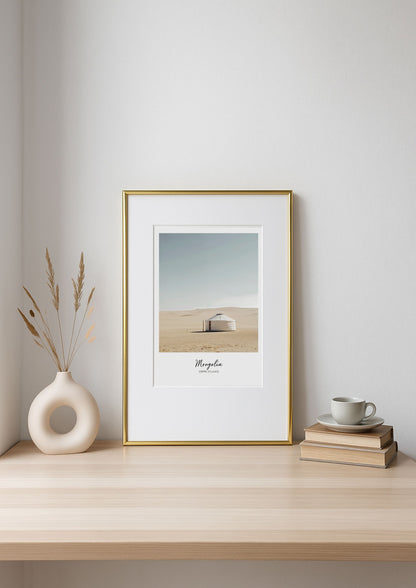 Framed artwork on a shelf with decor items